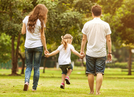 family running through grass