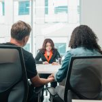 Husband and wife discussing custody with a family law lawyer