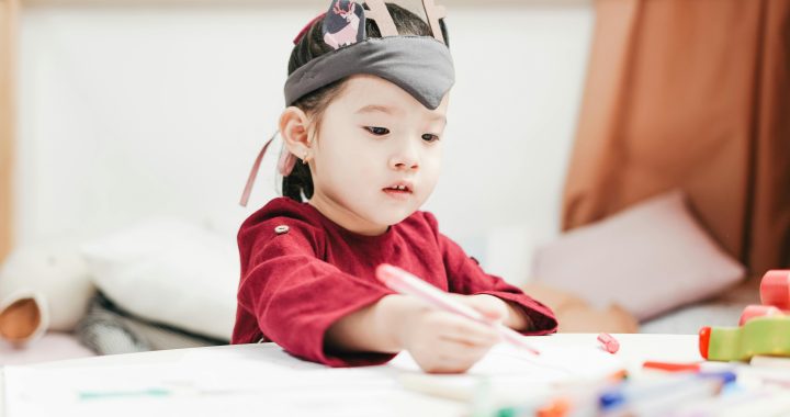 Girl in Red Dress at Childcare facility
